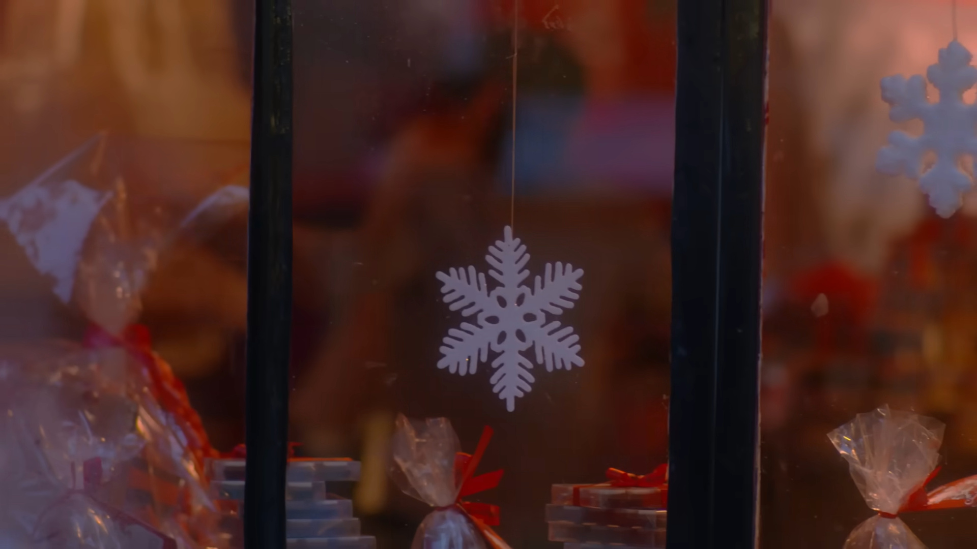 Blurry figures through the window.